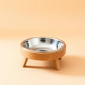 Elevated stainless steel pet bowl on wooden stand